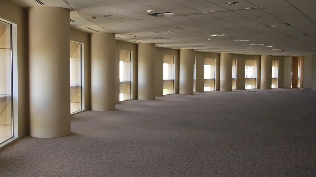 Vacant office floor with columns and windows, ready for a tenant to sign a commercial lease in NJ