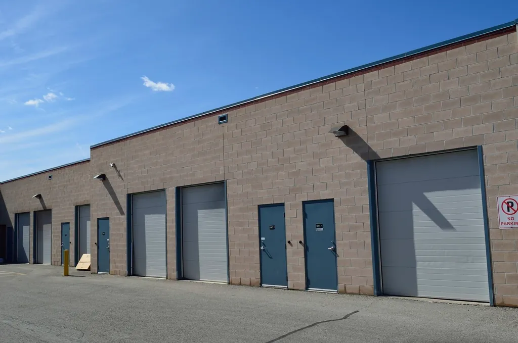 Block industrial building with several overhead loading doors