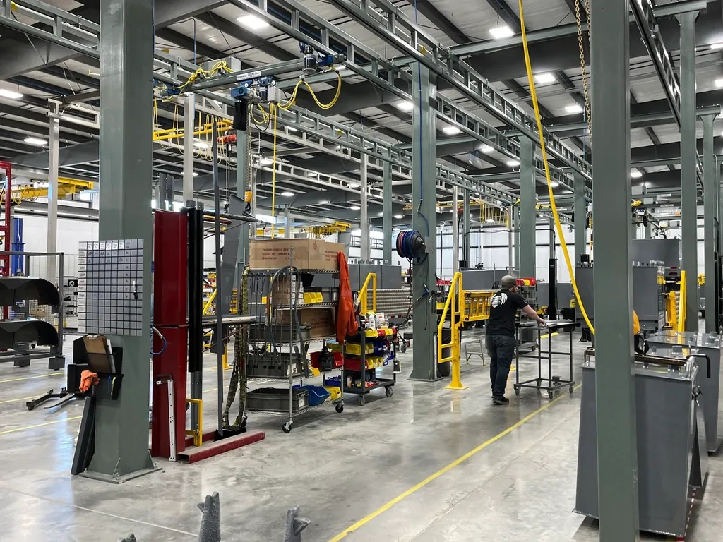 Factory floor with machinery, workstations and safety railings