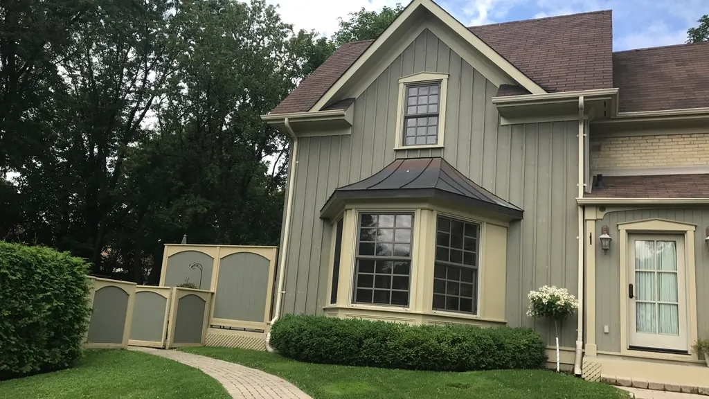 Sage green house with a brick walkway, a purchase that often starts with a mortgage pre-approval in NJ