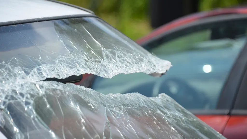 Shattered car windshield after a crash that could lead to a personal injury claim in NJ