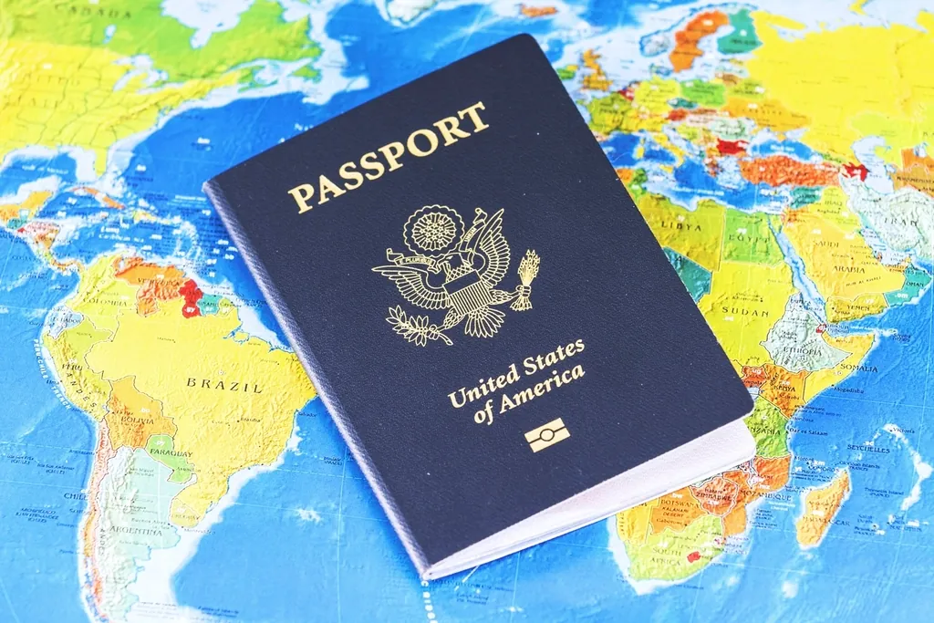 United States passport resting on a colorful world map