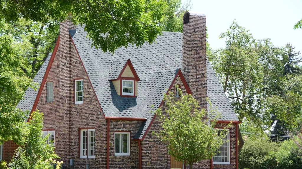 Brick Tudor house with a tall chimney, the kind of paid-off home behind a reverse mortgage in NJ