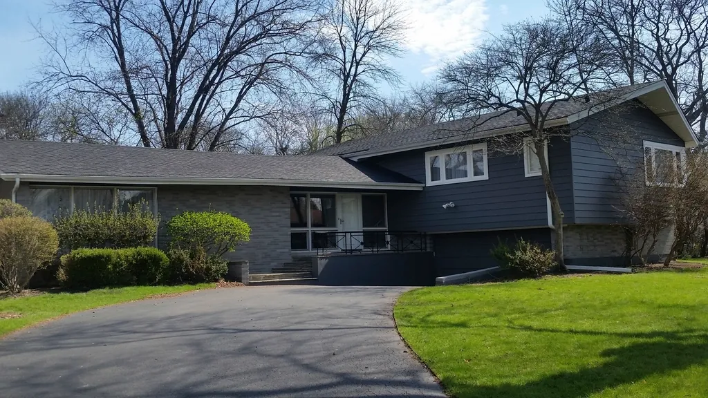 Split-level home with a gray shingle roof, the kind of house that may need a roof replacement in NJ